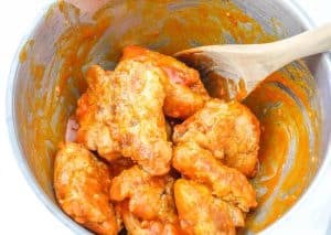 Coat chicken in buffalo sauce