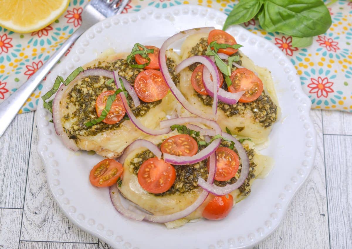 Pesto Bruschetta Chicken on plate with garnish