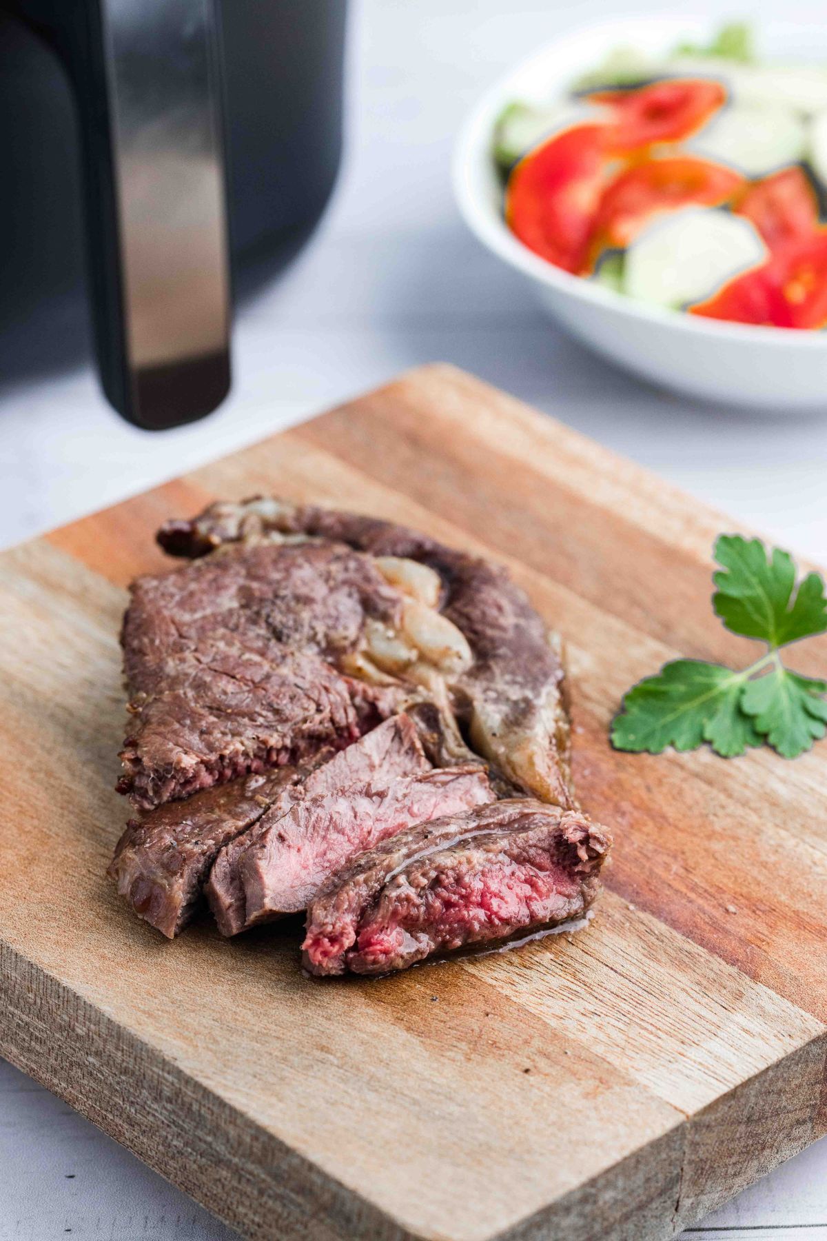 steak cut up on cutting board