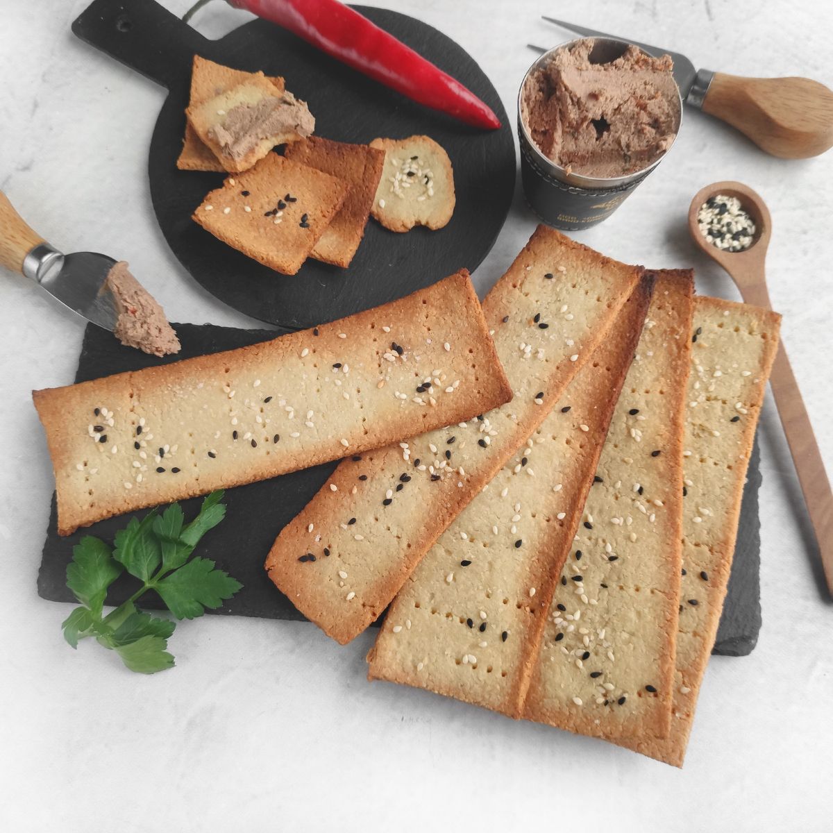 Homemade Crackers on board with spread