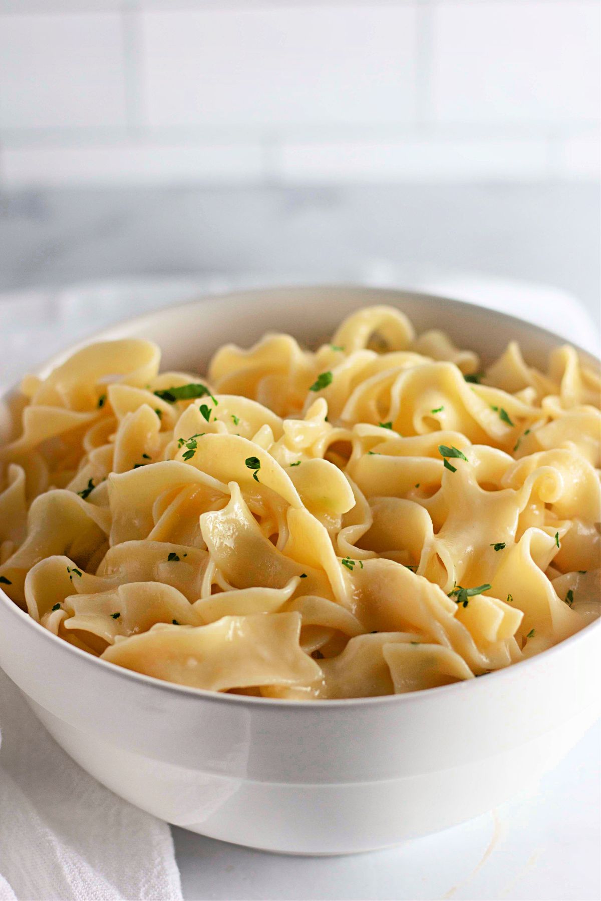 Lemon buttered noodles in a bowl.