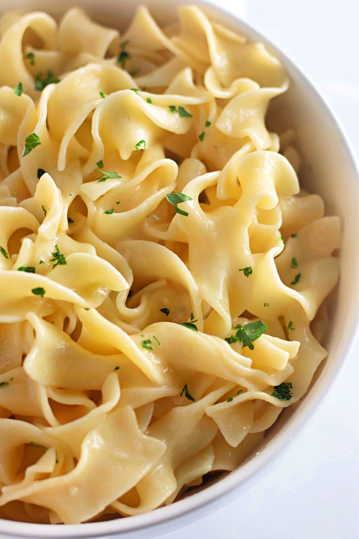 Lemon buttered noodles in a bowl.